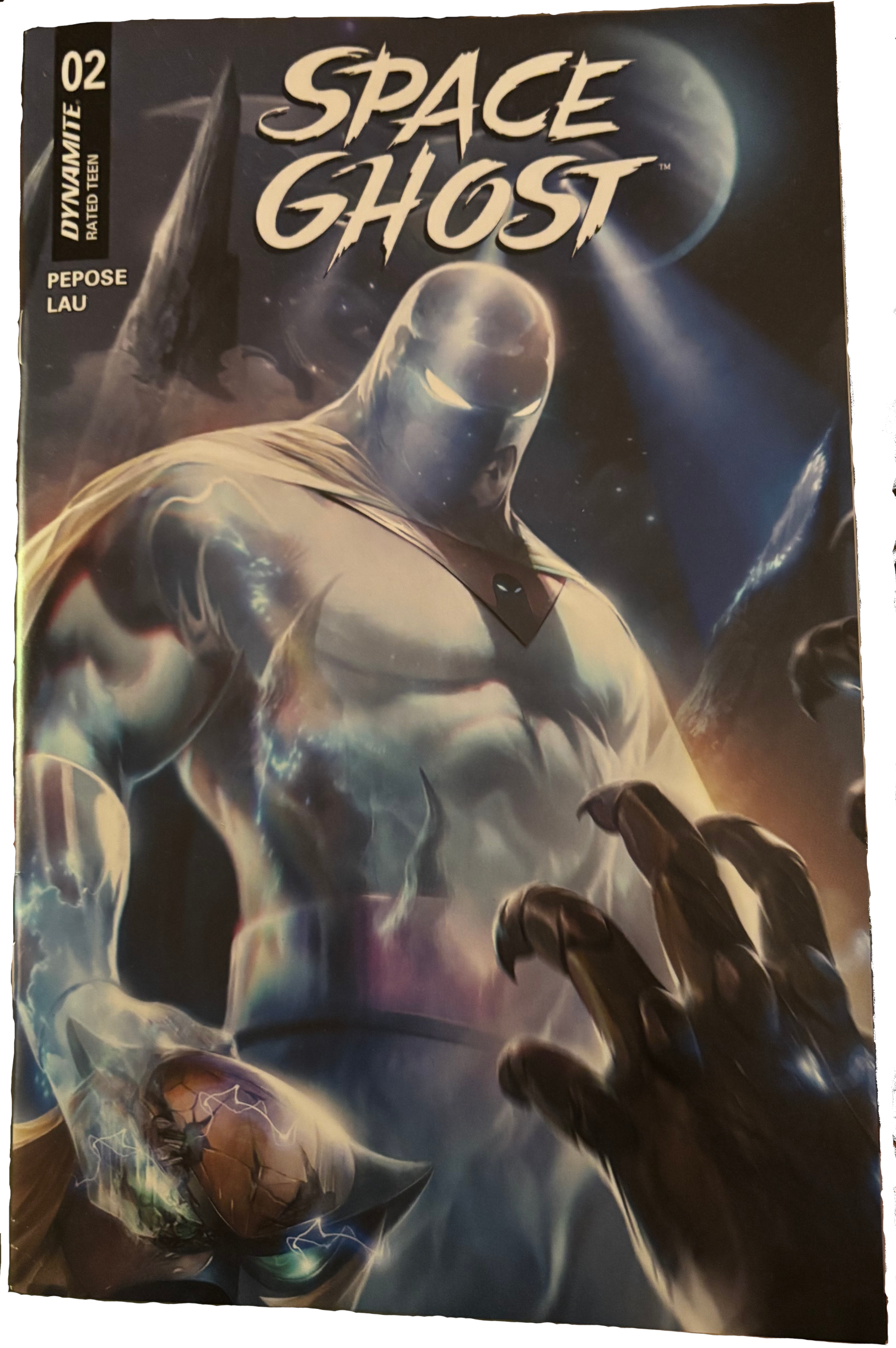 Comic cover of the second issue of the secodn volume of IDW's Space Ghost. It shows our hero standing over a clawed adversary, victorious but looking pissed.